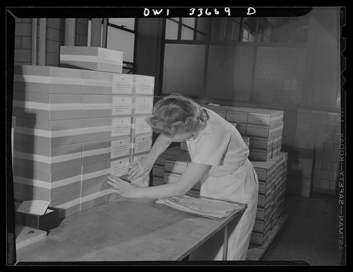 Parke, Davis and Company, manufacturing chemists, Detroit, Michigan. Labeling cartons containing the finished packages of blood plasma