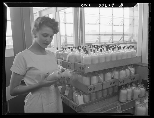 Parke, Davis and Company, manufacturing chemists, Detroit, Michigan. Inspection of blood plasma containers before final capping