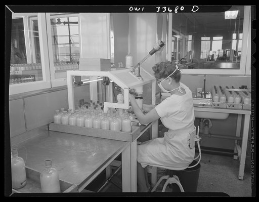 Parke, Davis and Company, manufacturing chemists, Detroit, Michigan. Capping bottles containing blood plasma