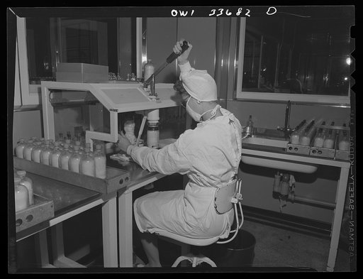 Parke, Davis and Company, manufacturing chemists, Detroit, Michigan. Capping bottles containing blood plasma