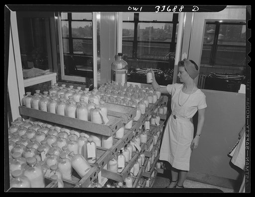 Parke, Davis and Company, Manufacture Chemists, Detroit, Mich. May 1943. Inspection of blood plasma containers after the final capping