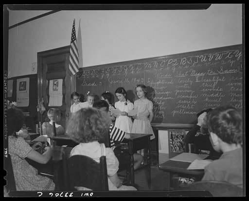 Schenectady, New York. Third graders at the Elmer Avenue Elementary School stand before the class reading their stories, written during the period, on their part in the salvage campaign