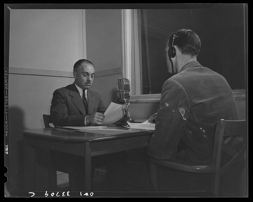 Schenectady, New York. A school principal giving a news broadcast. The news is broadcast twice a week, each time by a different principal