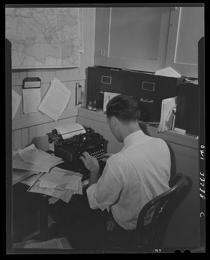 Untitled photo, possibly related to: Schenectady, New York. Writing the news broadcast for the schools. A fifteen-minute broadcast is given every Tuesday and Thursday