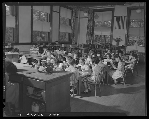 Schenectady, New York. At the Elmer Avenue School Library table and chairs are graduated in height. The teacher sits in the rear
