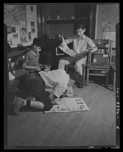 Schenectady, New York. Searching the daily paper for war news to keep the wall map at the Elmer Avenue Elementary School up to date