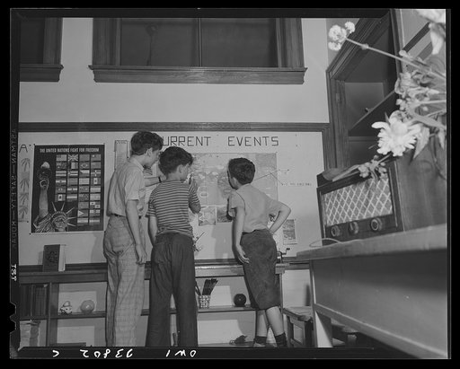 Schenectady, New York. Following the war news on wall maps as it is broadcast. The only complaint the youngsters had was that war doesn't move across the map fast enough