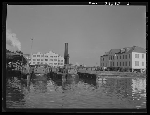 Freeport Sulphur Company, Grand Ecaille, Louisiana. A powerhouse and an office building. Launches in the foreground carry workers out from Port Sulphur daily