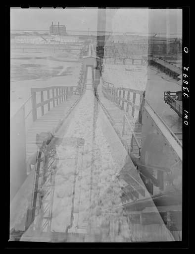 Untitled photo, possibly related to: Freeport Sulphur Company, Grand Ecaille, Louisiana. Conveyor belt which carries sulphur from vats to hopper where it is loaded on the barges