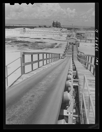 Freeport Sulphur Company, Grand Ecaille, Louisiana. Conveyor belt which carries sulphur from vats to hopper where it is loaded on the barges