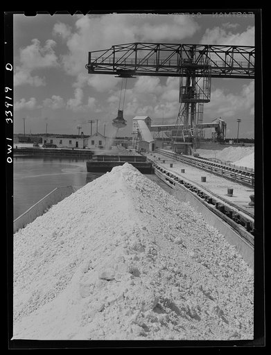 Freeport Sulphur Company, Port Sulphur, Louisiana. Small barges which are being unloaded into storage vats
