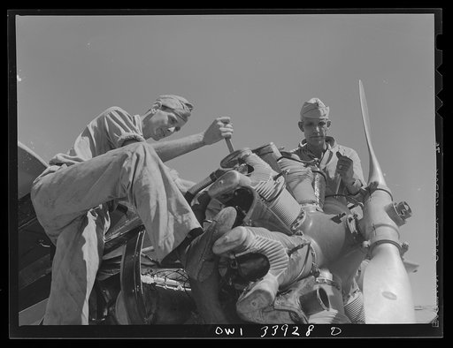 Corpus Christi, Texas. Mechanics repairing the engine of a plane at the Civil Air Patrol base