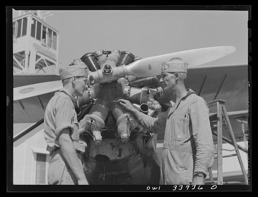 Corpus Christi, Texas. Seargent George Caveres (right), chief mechanic, instructing one of his new mechanics at the Civil Air Patrol base