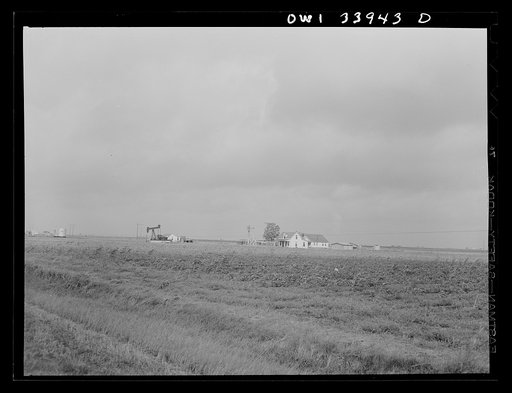 Untitled photo, possibly realted to: Victoria County, Texas. Pumping an oil well on a farm
