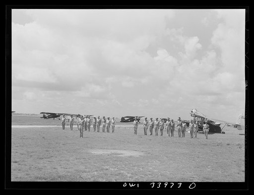 Untitled photo, possibly related to: Corpus Christi, Texas. Officers of the Civil Air Patrol lined up in front of the planes for inspection