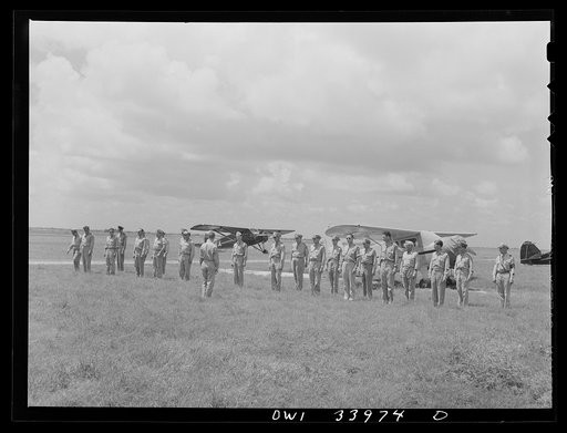 Corpus Christi, Texas. Officers of the Civil Air Patrol lined up in front of the planes for inspection