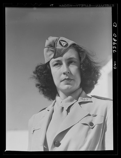 Untitled photo, possibly related to: Corpus Christi, Texas. Seargent Pat Pate, who formerly worked in a law office in Corpus Christi, now a member of the Civil Air Patrol