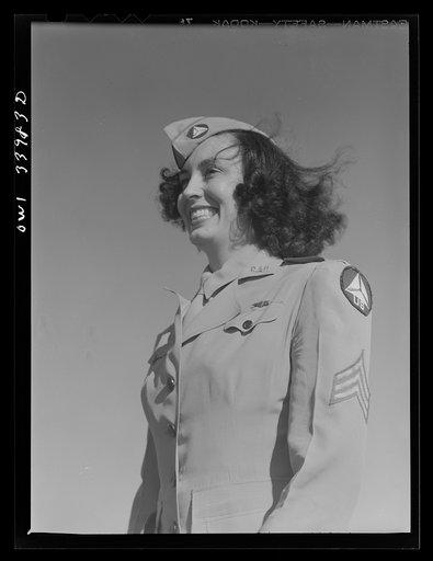 Untitled photo, possibly related to: Corpus Christi, Texas. Seargent Pat Pate, who formerly worked in a law office in Corpus Christi, now a member of the Civil Air Patrol