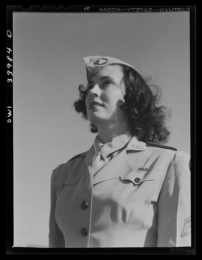Untitled photo, possibly related to: Corpus Christi, Texas. Seargent Pat Pate, who formerly worked in a law office in Corpus Christi, now a member of the Civil Air Patrol