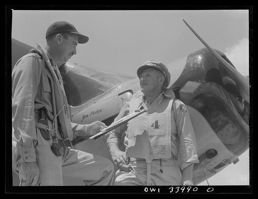 Corpus Christi, Texas. Lieutenant James Pedon and Flight Officer Phil Lebman, members of the Civil Air Patrol, about to go on a routine flight for coastal patrol duty. Lieutenant Pedon formerly operated an advertising agency in Los Angeles; Flight Officer Lebman was a farmer at Live Oak, Texas
