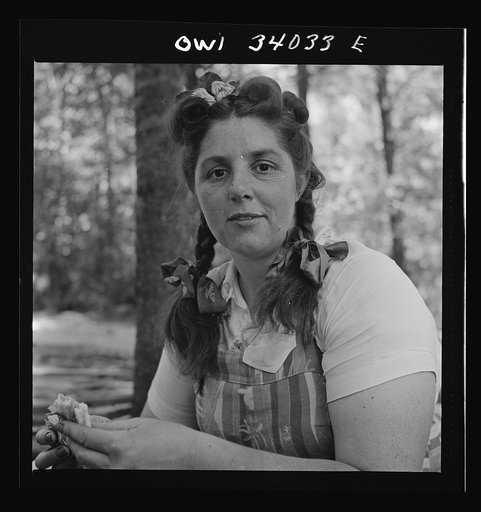 Untitled photo, possibly related to: Turkey Pond, near Concord, New Hampshire. Women workers employed by a U.S. Department of Agriculture timber salvage sawmill. Mrs. Violet Storey, "takes away," is a farmer's wife with six children