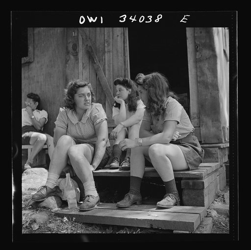Untitled photo, possibly related to: Turkey Pond, near Concord, New Hampshire. Women workers employed by U.S. Department of Agriculture timber salvage sawmill. Ruth DeRoche and Norma Webber, eighteen year old "pit-women," relaxing after lunch