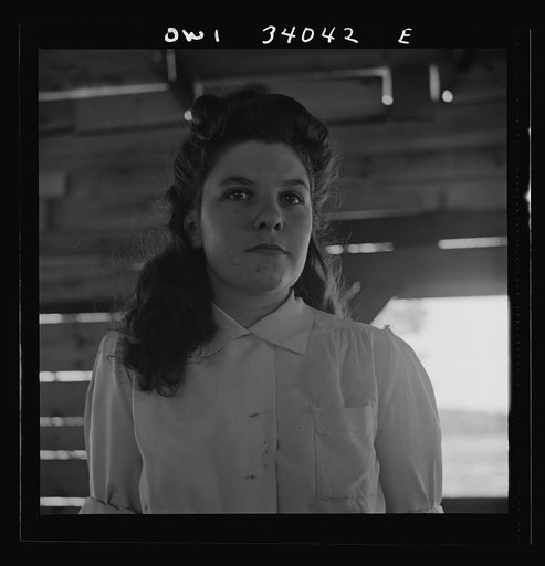 Untitled photo, possibly related to: Turkey Pond, near Concord, New Hampshire. Women workers employed by a U.S. Department of Agriculture timber salvage sawmill. Barbara Webber, twenty-one year old edger, finds her job harder physically than working in a laundry, but she likes it better because it i