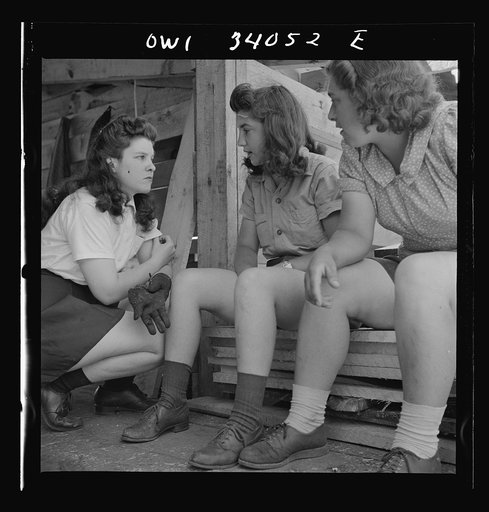 Turkey Pond, near Concord, New Hampshire. Women workers employed by U.S. Department of Agriculture timber salvage sawmill. A break in the work comes every once in a while when equipment needs minor repairs or adjustments. Left to right, Barbara and Norma Webber, and Ruth De Roche