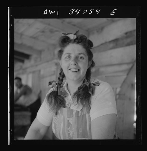 Untitled photo, possibly related to: Turkey Pond, near Concord, New Hampshire. Women workers employed by a U.S. Department of Agriculture timber salvage sawmill. Mrs. Violet Storey, "takes away," is a farmer's wife with six children
