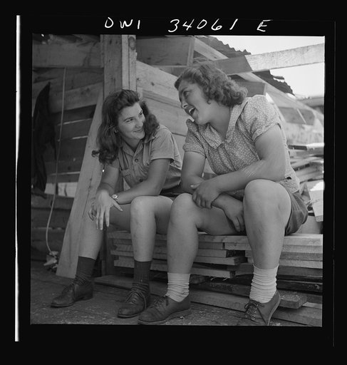 Untitled photo, possibly related to: Turkey Pond, near Concord, New Hampshire. Women workers employed by U.S. Department of Agriculture timber salvage sawmill. Ruth DeRoche and Norma Webber, eighteen year old "pit-women," relaxing after lunch