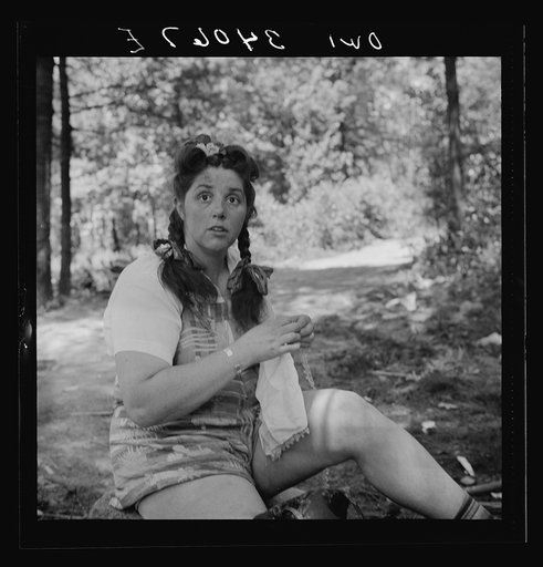 Untitled photo, possibly related to: Turkey Pond, near Concord, New Hampshire. Women workers employed by a U.S. Department of Agriculture timber salvage sawmill. Mrs. Violet Storey, "take-away," brought her sewing along to make full use of her lunch hour. She is a farmer's wife and the mother of six