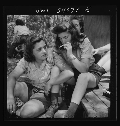 Turkey Pond, near Concord, New Hampshire. Women workers employed by U.S. Department of Agriculture timber salvage sawmill. Ruth DeRoche and Norma Webber, eighteen year old "pit-women," relaxing after lunch