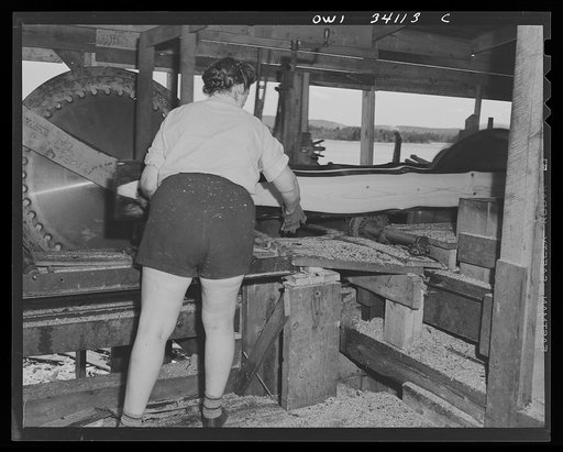 Turkey Pond, New Hampshire. Mrs. Violet Storey "take away" takes the boards as they come from the main saw, at the Turkey Pond sawmill