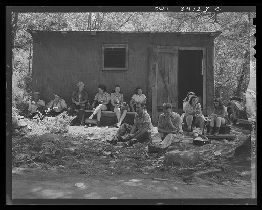 Turkey Pond, near Concord, New Hampshire. Women workers employed by a U.S. Department of Agriculture timber salvage sawmill. Employees bring their lunch, usually sandwiches and pop or a thermos jug of coffee. The two men at the far left have been rounding up logs on the pond, a job which they do at 