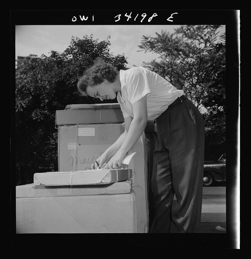Untitled photo, possibly related to: New Britain, Connecticut. Mrs. Dorothy Bell, Irish-German descent, twenty-seven years old, mother of two children, employed at the American Railway Express Company, sorting packages, weighting them etc., earning seventy-nine and one-half cents an hour
