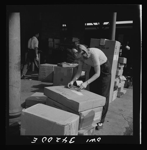 Untitled photo, possibly related to: New Britain, Connecticut. Miss Ida Hicks, Lithuanian twenty-eight years old, employed at the American Railway Expesss Company, sorting packages, weighting them, etc., earns seventy-nine and one-half cents an hour. She formerly worked in a defense plant