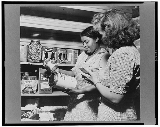 New Britain, Connecticut. A child care center opened September 15, 1942 for thirty children, ages two through five, of mothers engaged in war industry. The hours are 6:30 a.m. to 6 p.m., six days per week. Miss Machmer and the dietician checking the amount of food used during the month and making a 