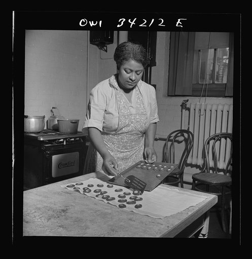 New Britain, Connecticut. A child care center opened September 15, 1942, for thirty children, ages two through five of mothers engaged in war industry. The hours are 6:30 a.m. to 6 p.m. six days per week. The dietician baking cookies
