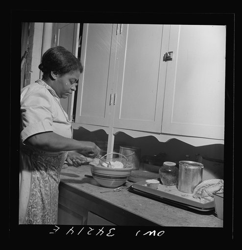 New Britain, Connecticut. A child care center opened September 15, 1942, for thirty children, ages two through five of mothers engaged in war industry. The hours are 6:30 a.m. to 6 p.m. six days per week. The dietician preparing a meal
