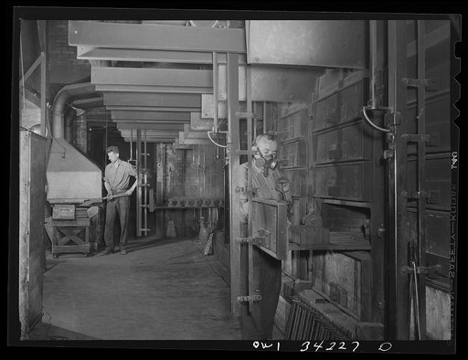 New Britain, Connecticut. Men employed at the Landers, Frary and Clark plant. Working in the core ovens, these ovens give off intense heat and unpleasant fumes. The man in the foreground is wearing an oxygen mask