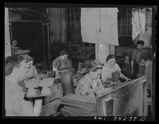 New Britain, Connecticut. Women at the Lander, Frary and Clark plant. Processing cores, to be used by the Army for making molds for meat choppers