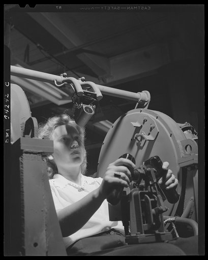 New Britain, Connecticut. Women employed at the Landers, Frary and Clark plant. Testing a new anti-aircraft gun. This girl's job is to inspect guns and their mounts