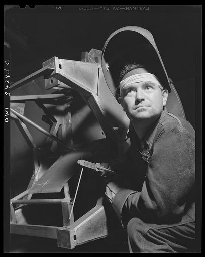 New Britain, Connecticut. Welder at the Landers, Frary and Clark plant, working on an anti-aircraft gun mount