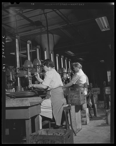 New Britain, Connecticut. Women punch press machine operators at the Landers, Frary and Clark plant