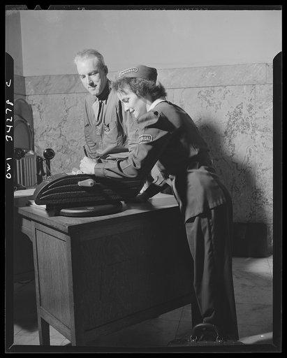 New Britain, Connecticut. A girl who drives the shuttle truck between the plants of the Fafnir Bearing Company delivering packages and passengers