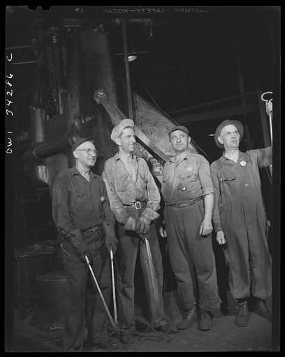 New Britain, Connecticut. Forging crew at the Fafnir Bearing Company. Left to right: Nelson Sartwell, hammersmith; Bidsell Hughes, twenty-five years old, steam-hammersmith; Peter Juliania, forty-seven years old, steamhammer operator; and Joseph Coilnick, hammer man