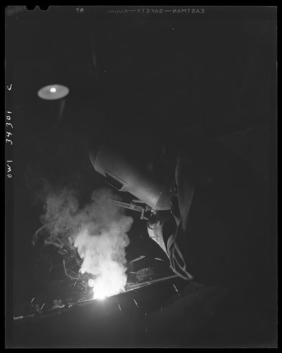 New Britain, Connecticut. A welder at the Landers, Frary and Clark plant
