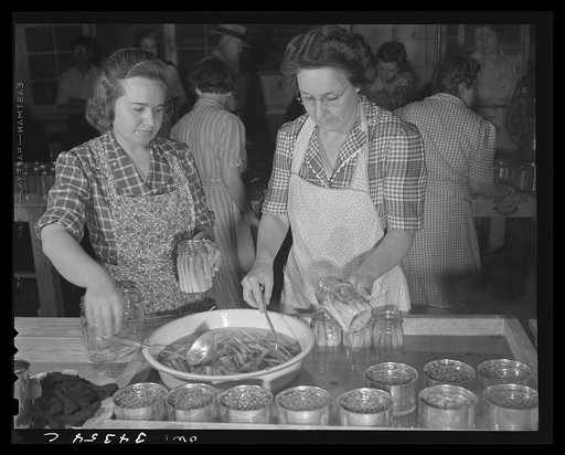 Jeffersontown, Kentucky. The Jefferson County ommunity cannery, started by the WPA (Work Projects Administration), now conducted by the state (?) vocational education department. Women pay three cents each for cans and two cents per can for use of the pressure cooker. Mrs. Fred Kemper(left), and Mrs