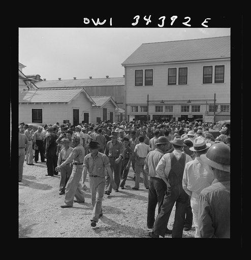 New Orleans, Louisiana. Workers leaving the Higgins shipyards at four pm