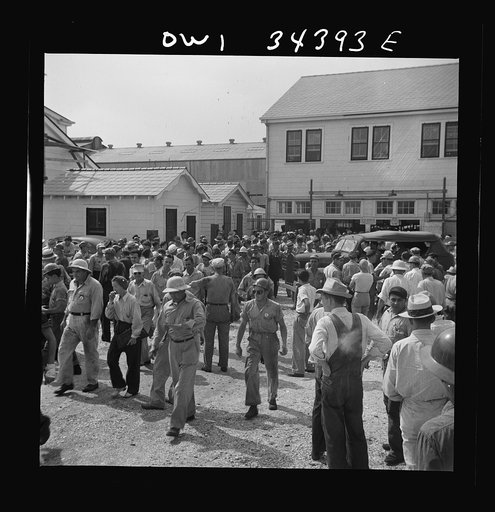 New Orleans, Louisiana. Workers leaving the Higgins shipyards at four p.m.